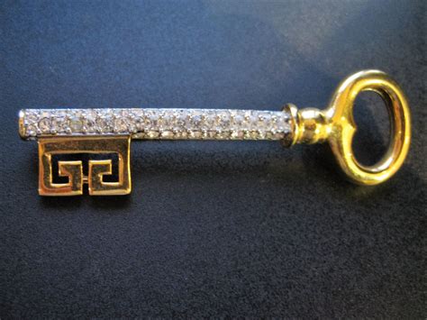 givenchy golden key pin brooch new york 1977|Vintage Large Givenchy 1977 Lucite Gold Tone Pin .